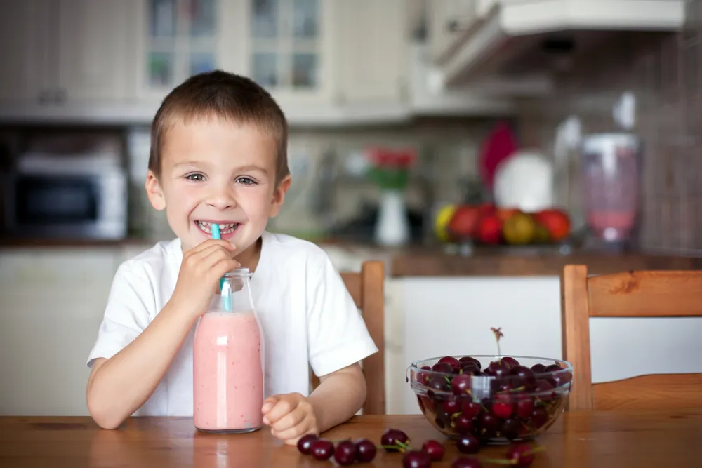 a kid drinking a nutritious protein shake 1718697326226 a kid drinking a nutritious protein shake 1718697326226